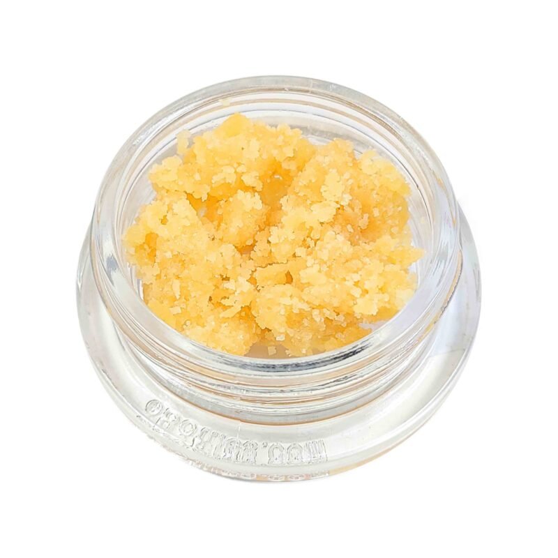 Golden-yellow Royal Kush Crumble concentrate wax by Monster of Terps in a clear container.