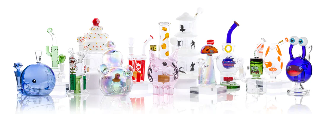 Different types of bongs displayed on a table