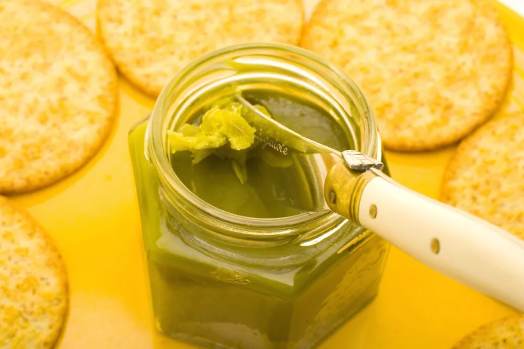 Step-by-step process showing how to make cannabutter at home with decarboxylated cannabis and melted butter